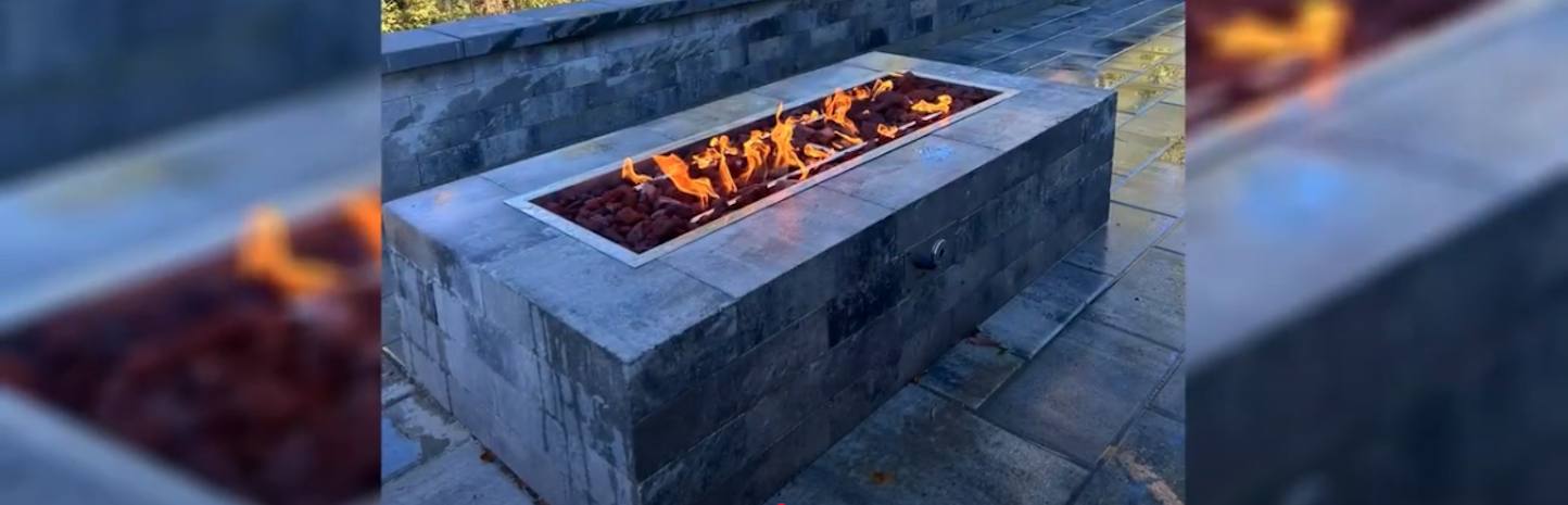 Close-up of custom steel fire pit insert with logo